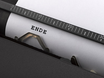 "The end" message typed by vintage typewriter.